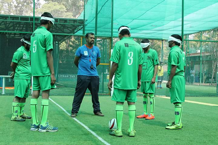 Coach giving instruction to players
