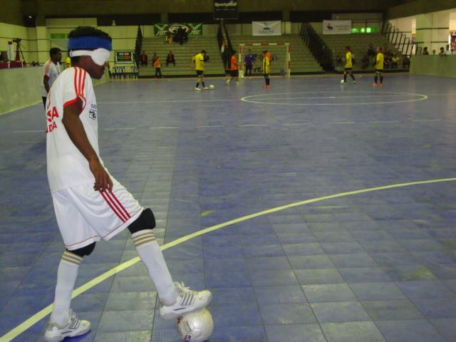 Indian player kicking ball