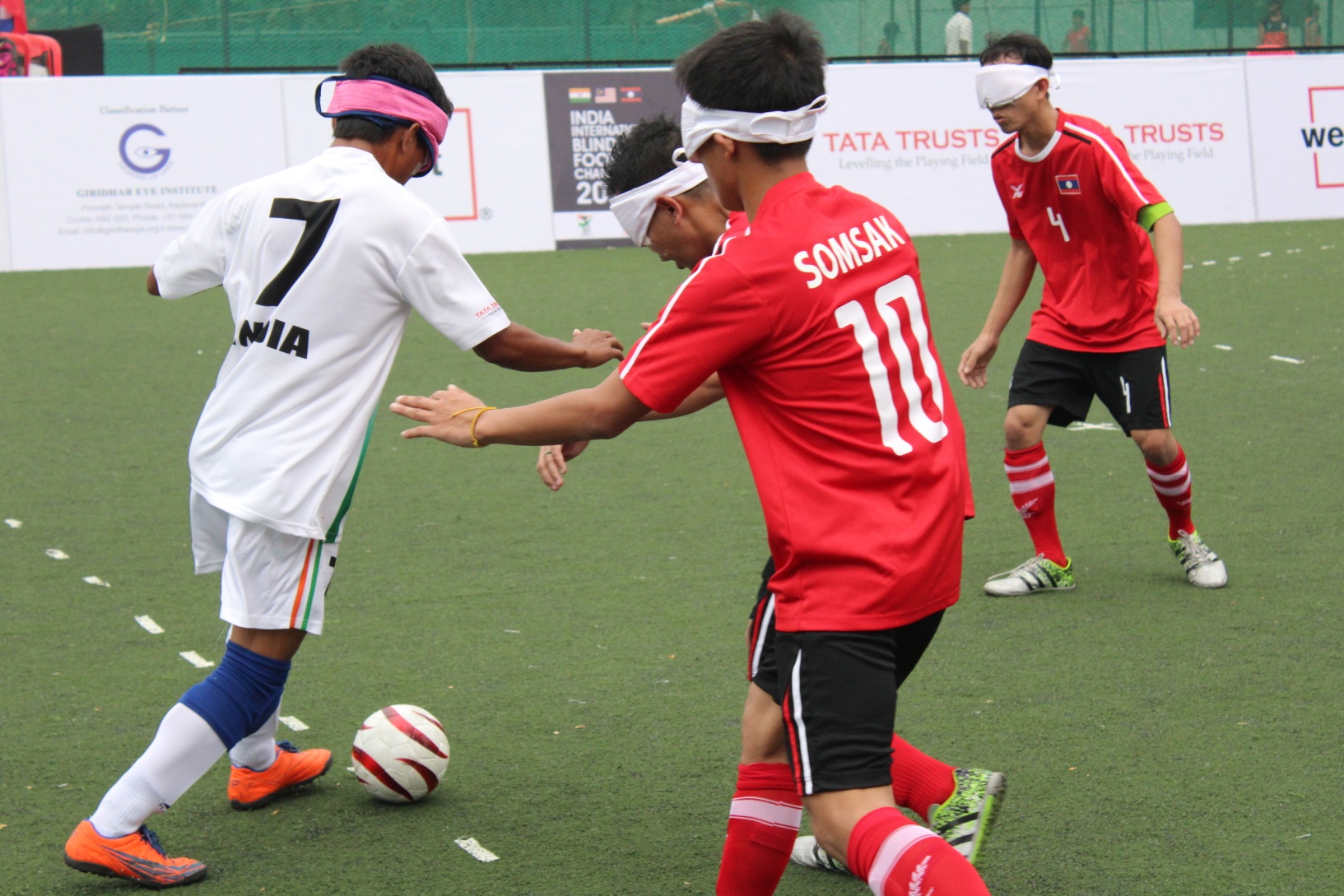 Laos players defending attack from indian player