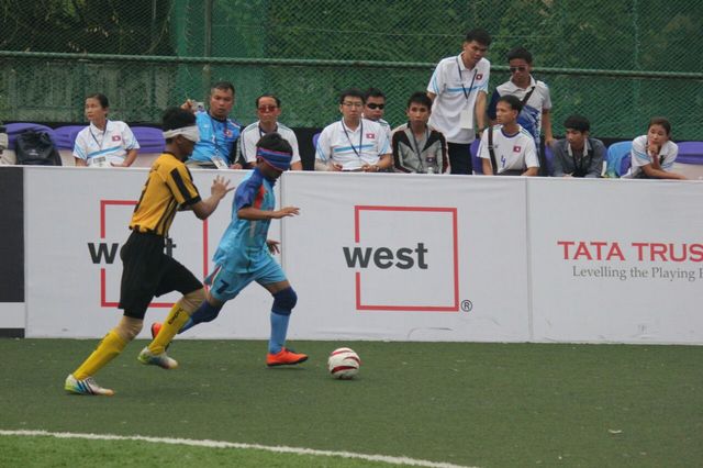 malasian player trying to stop indian player's attack
