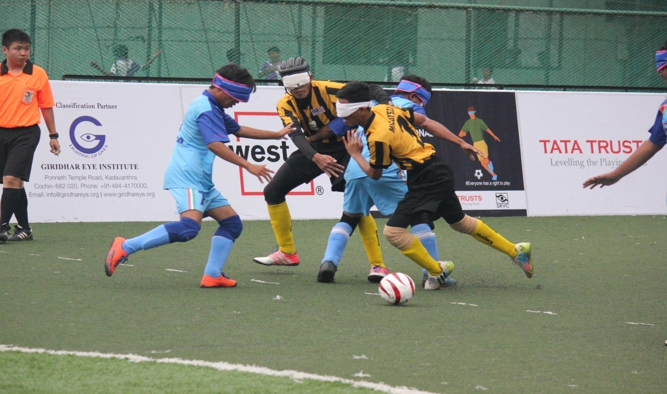 Team india and malaysia trying to get ball