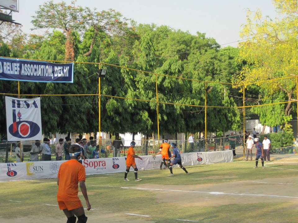 Renjith fights for the ball on the far side