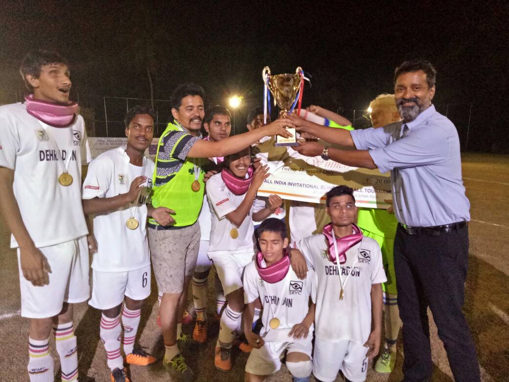 Actor Sijoy Varghese giving trophy to winners of Second All India Invitational Blind Football Tournament